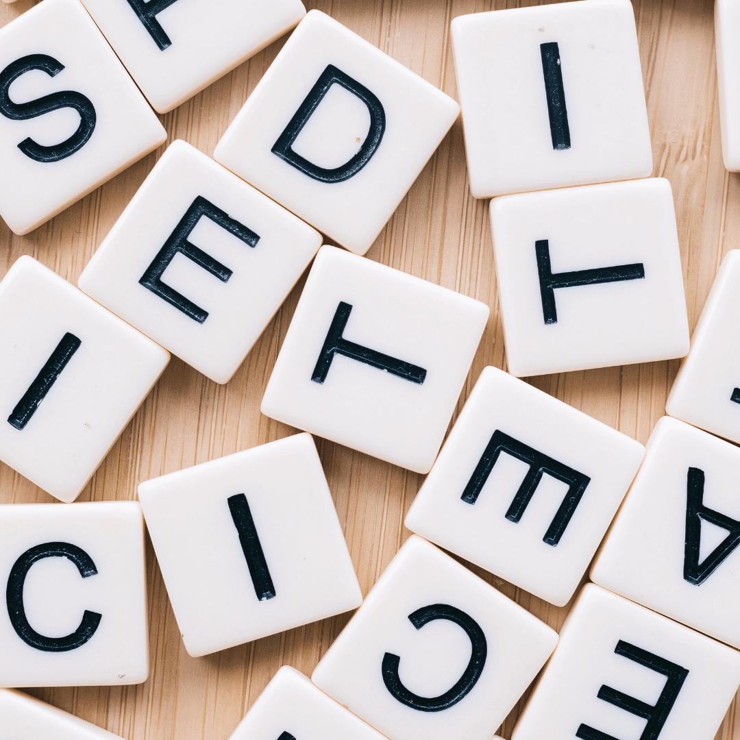 Letter tiles scattered on a desk