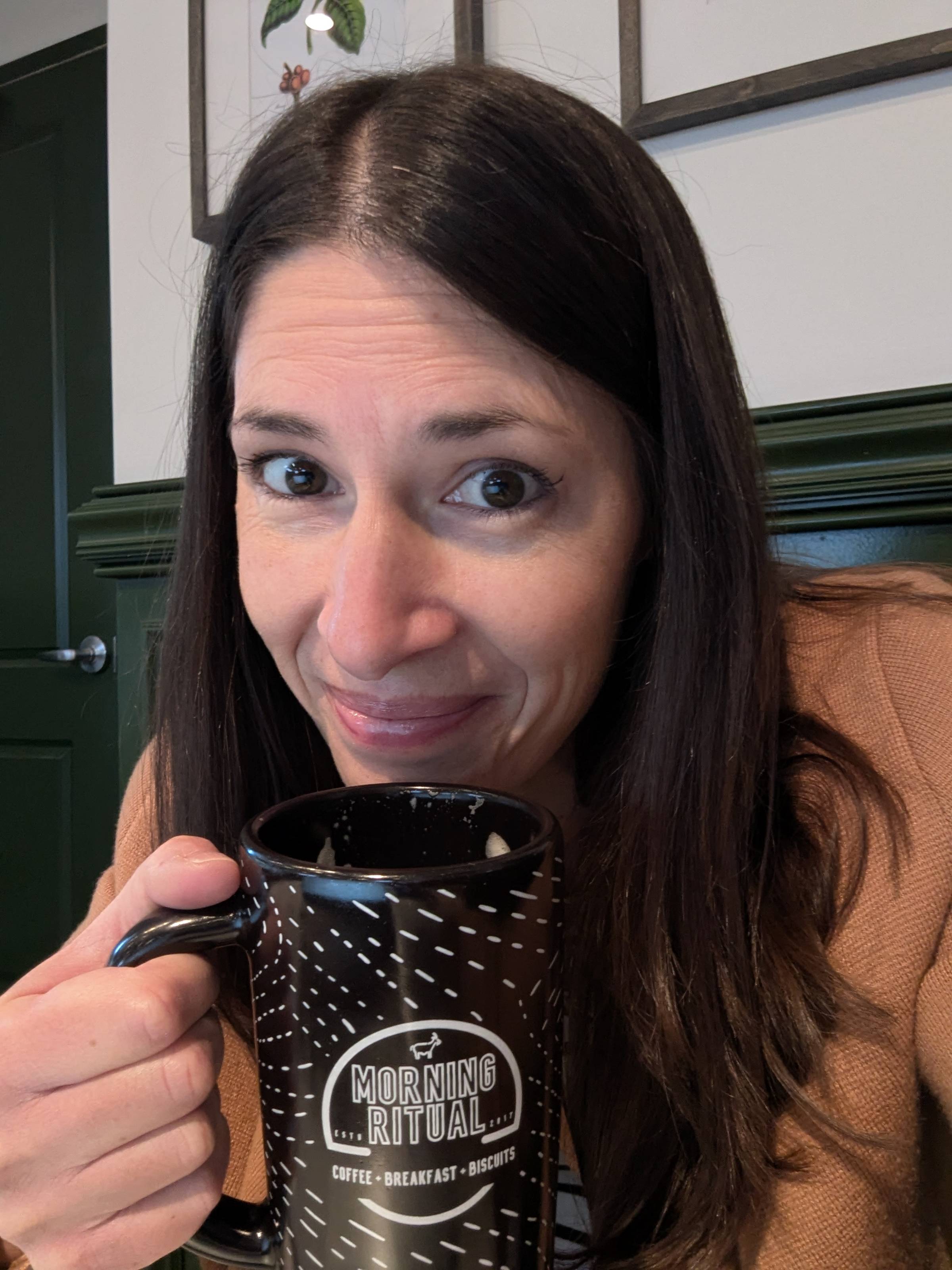 Allison drinking coffee.