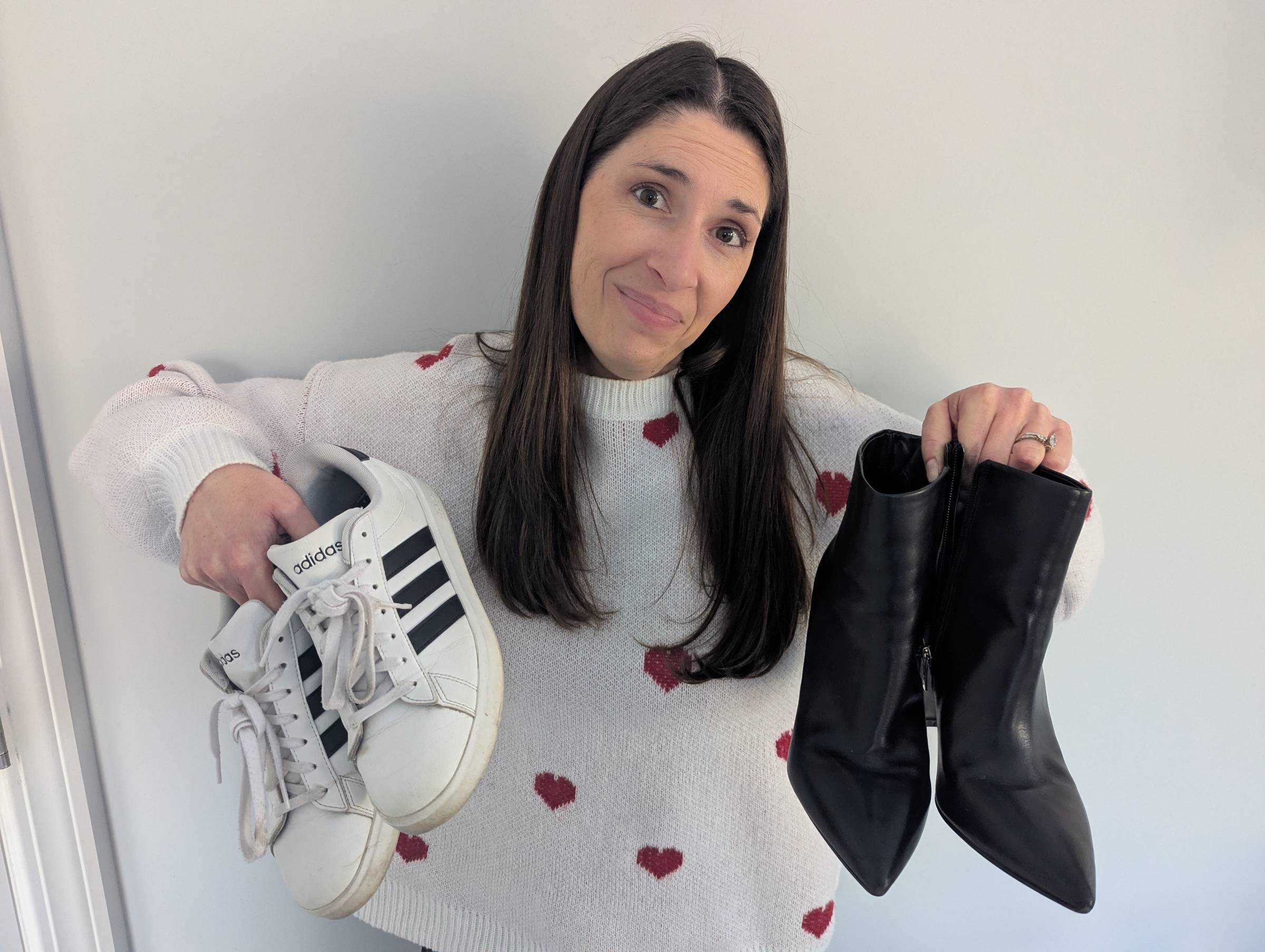 Allison holding shoes that inspired a high-engagement post on LinkedIn