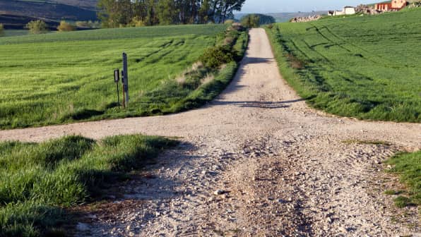 two paths cross in open field