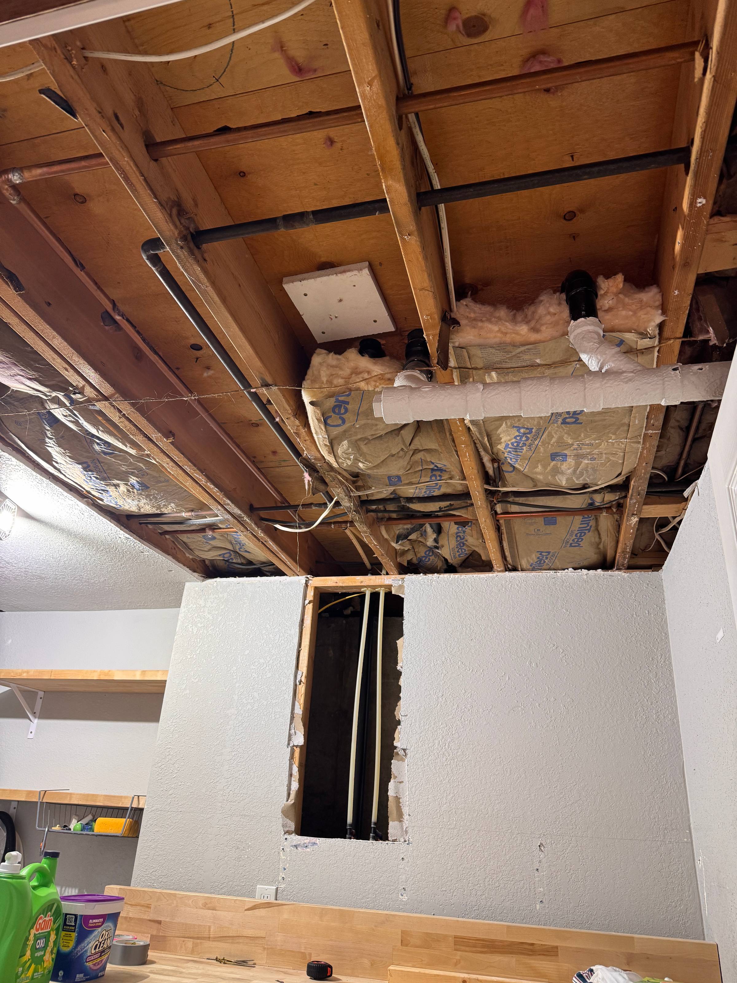 Torn up ceiling without drywall