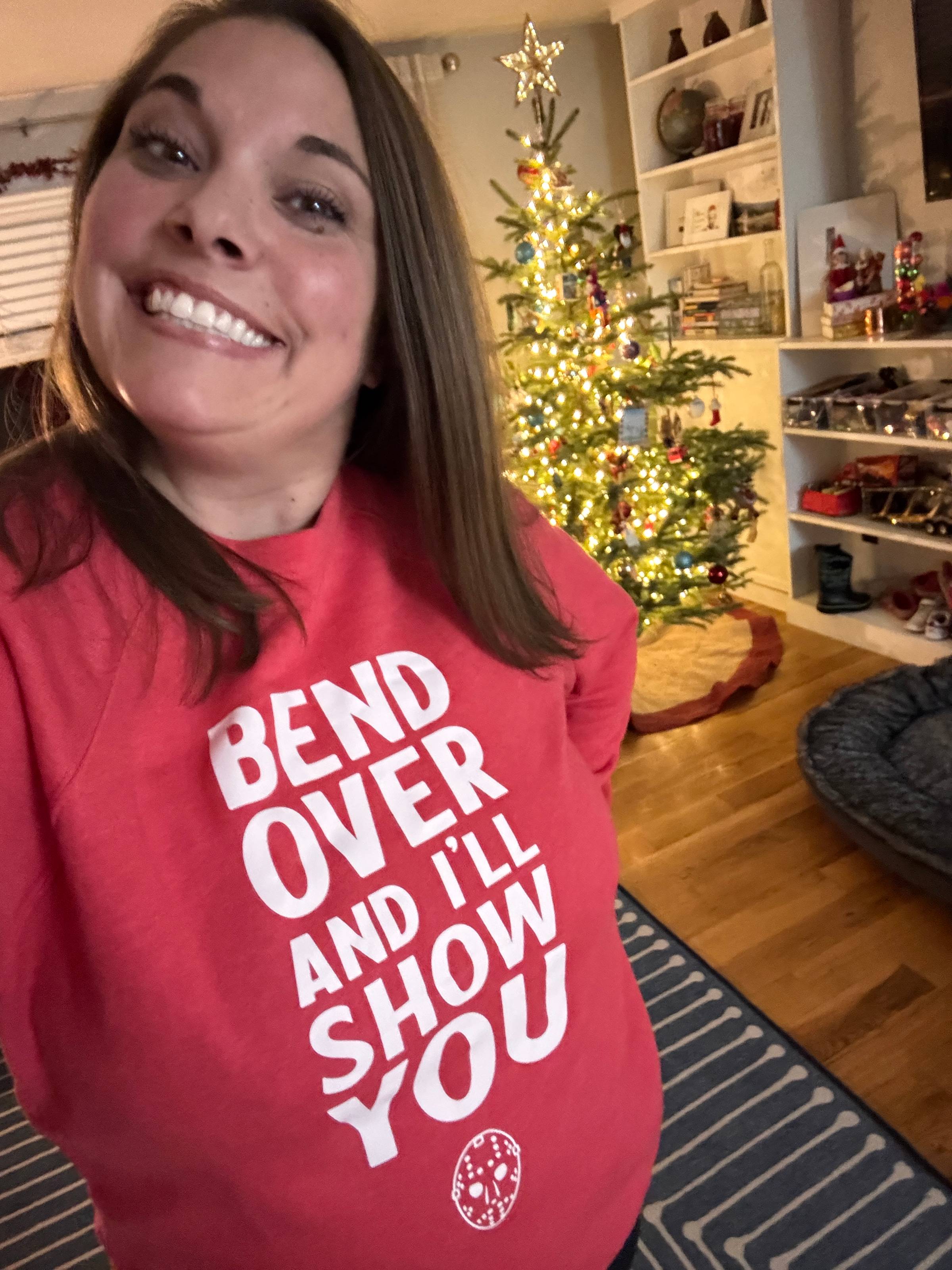 a sweatshirt that says "bend over and i'll show you"