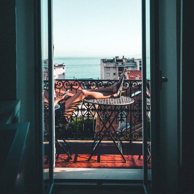 person sitting on balcony