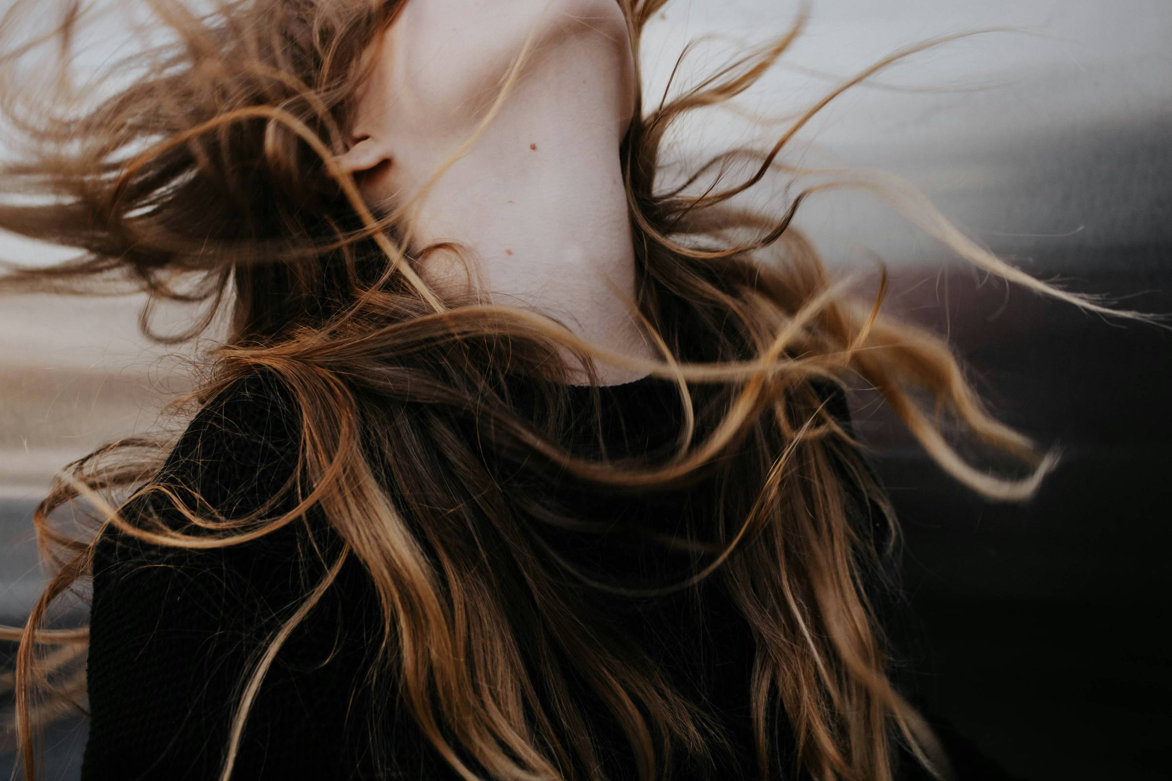 Woman with wind blown hair.