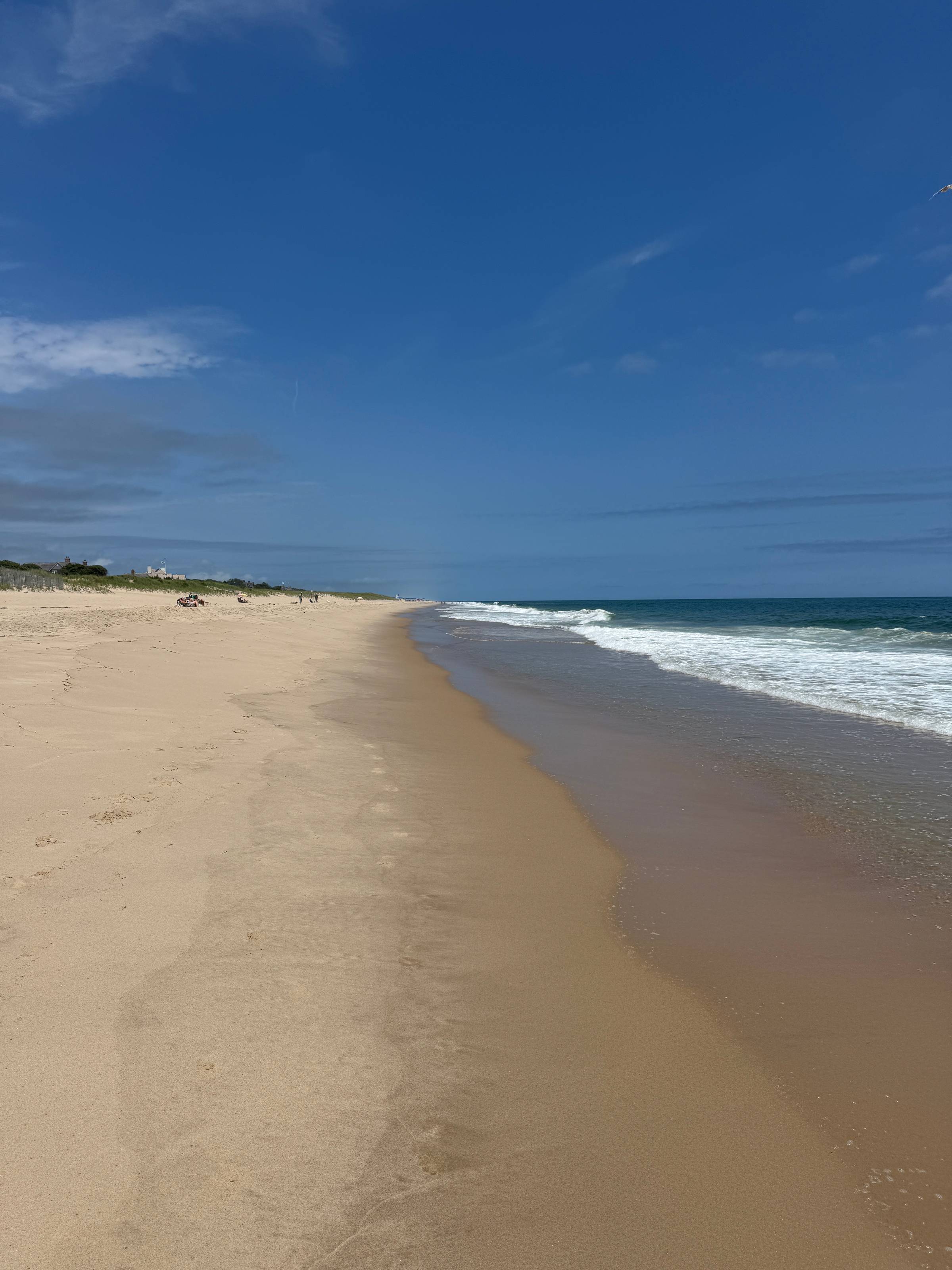 Sand and ocean waves at the beach.