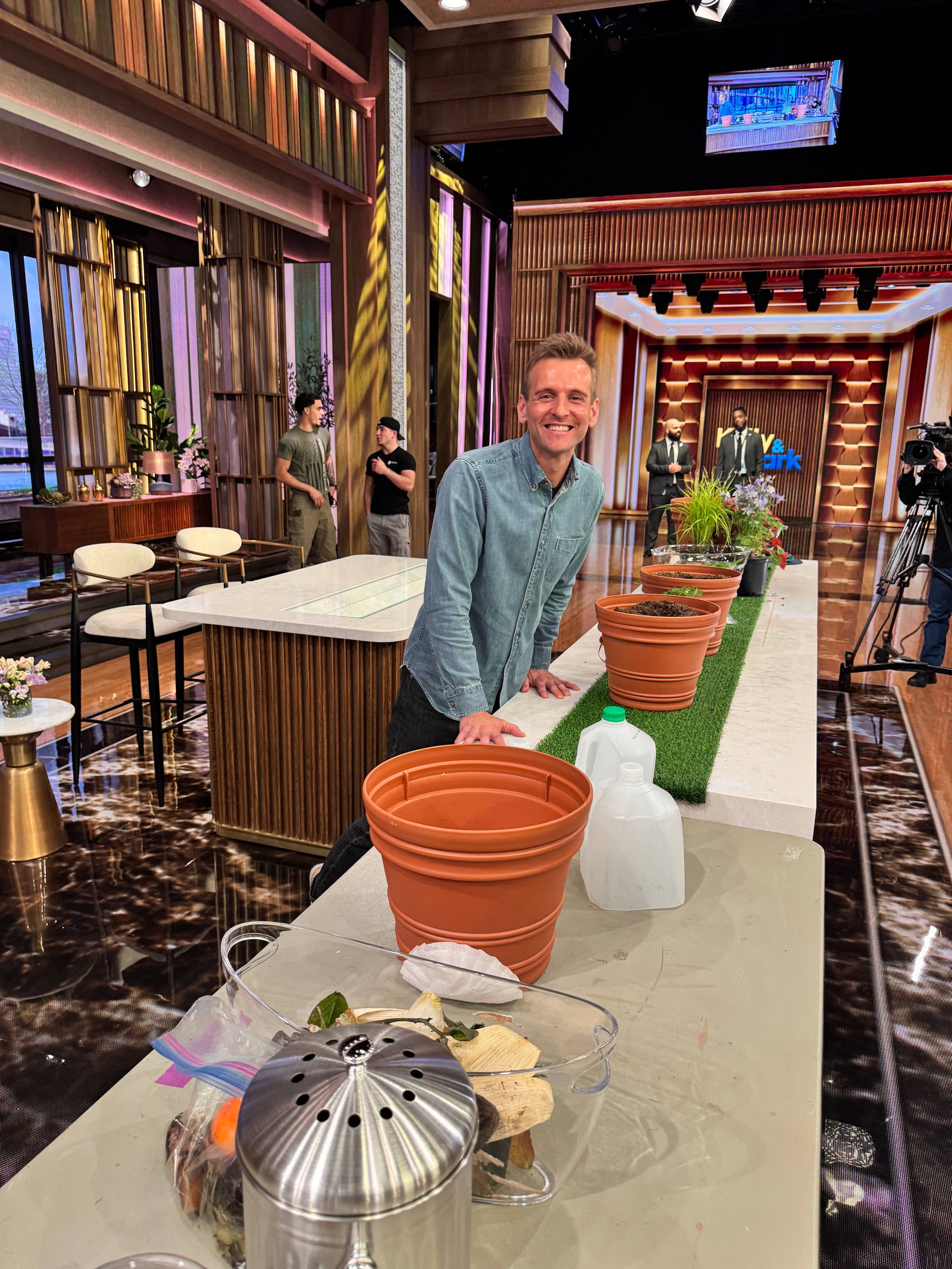 Kaleb Wyse standing ready to film a live segment.