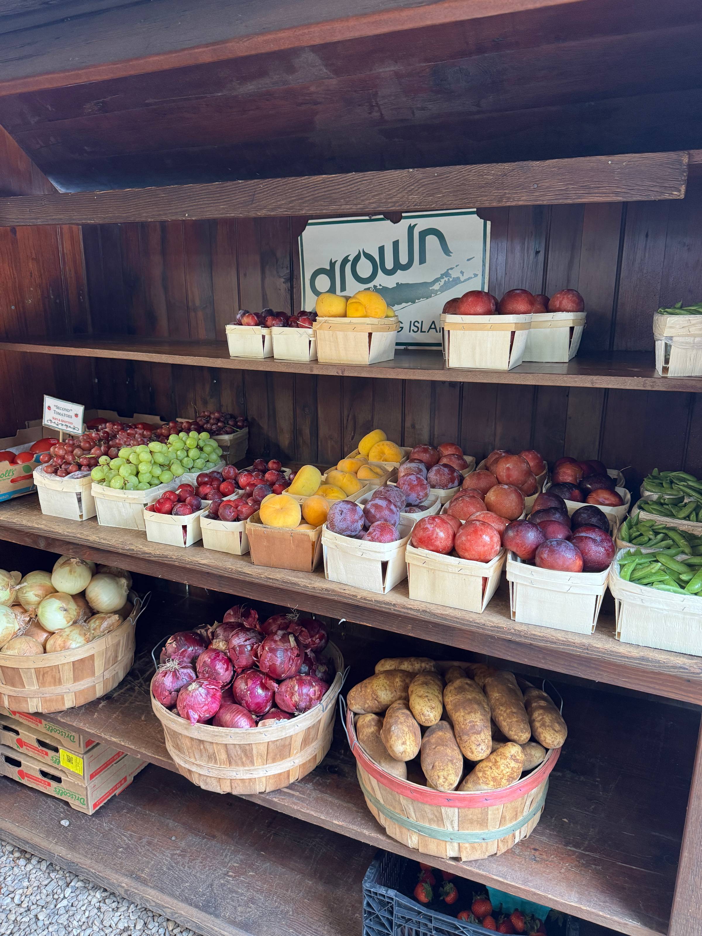 Lots of baskets of fresh produce to be sold.