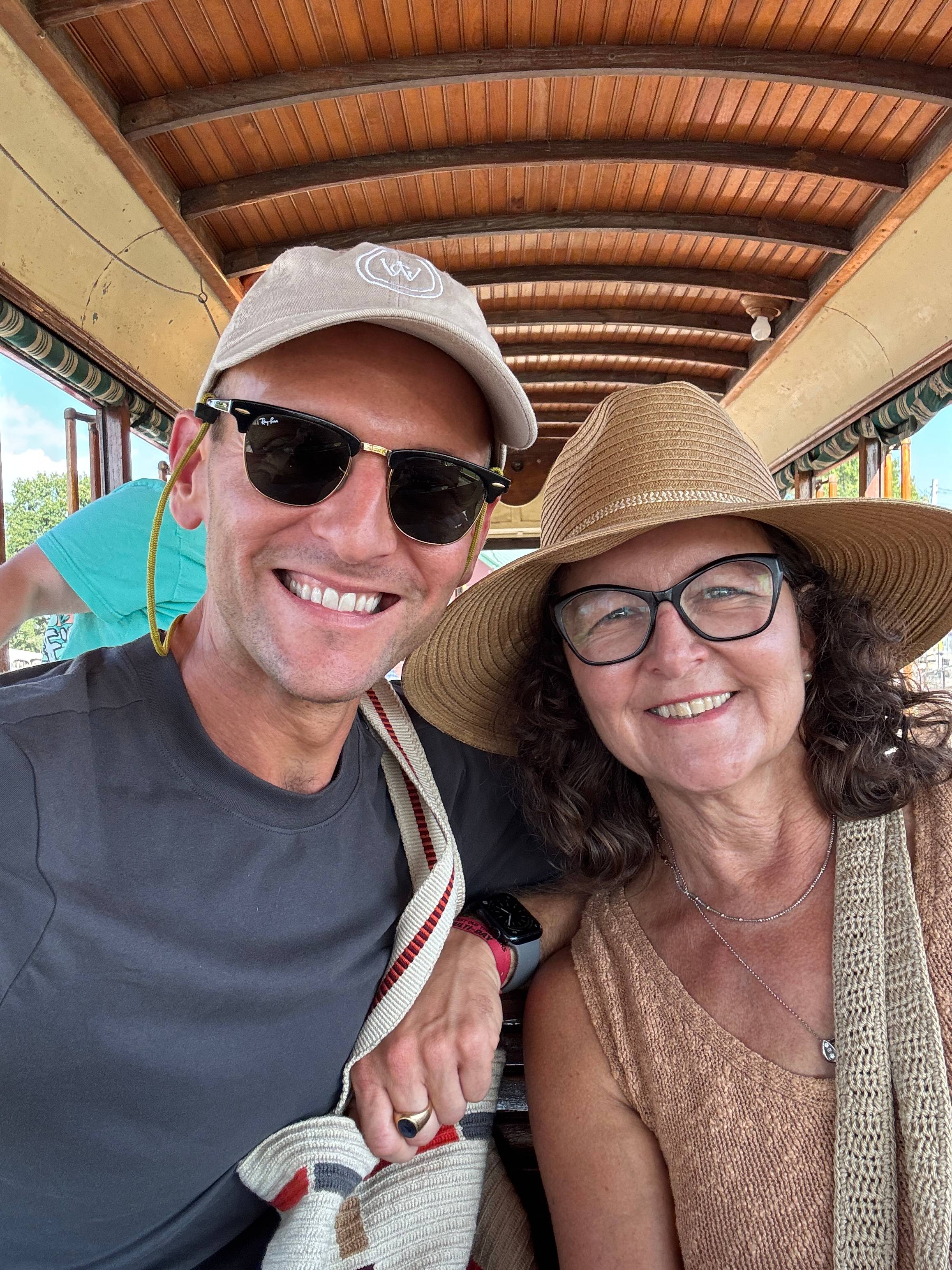 Kaleb Wyse and his mom Jodi sitting on a trolley.