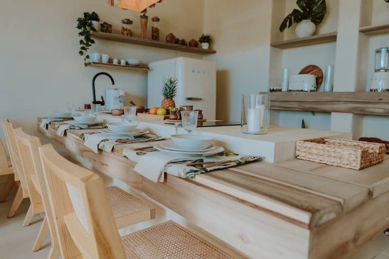Dining table set for a lovely, sunlit meal.