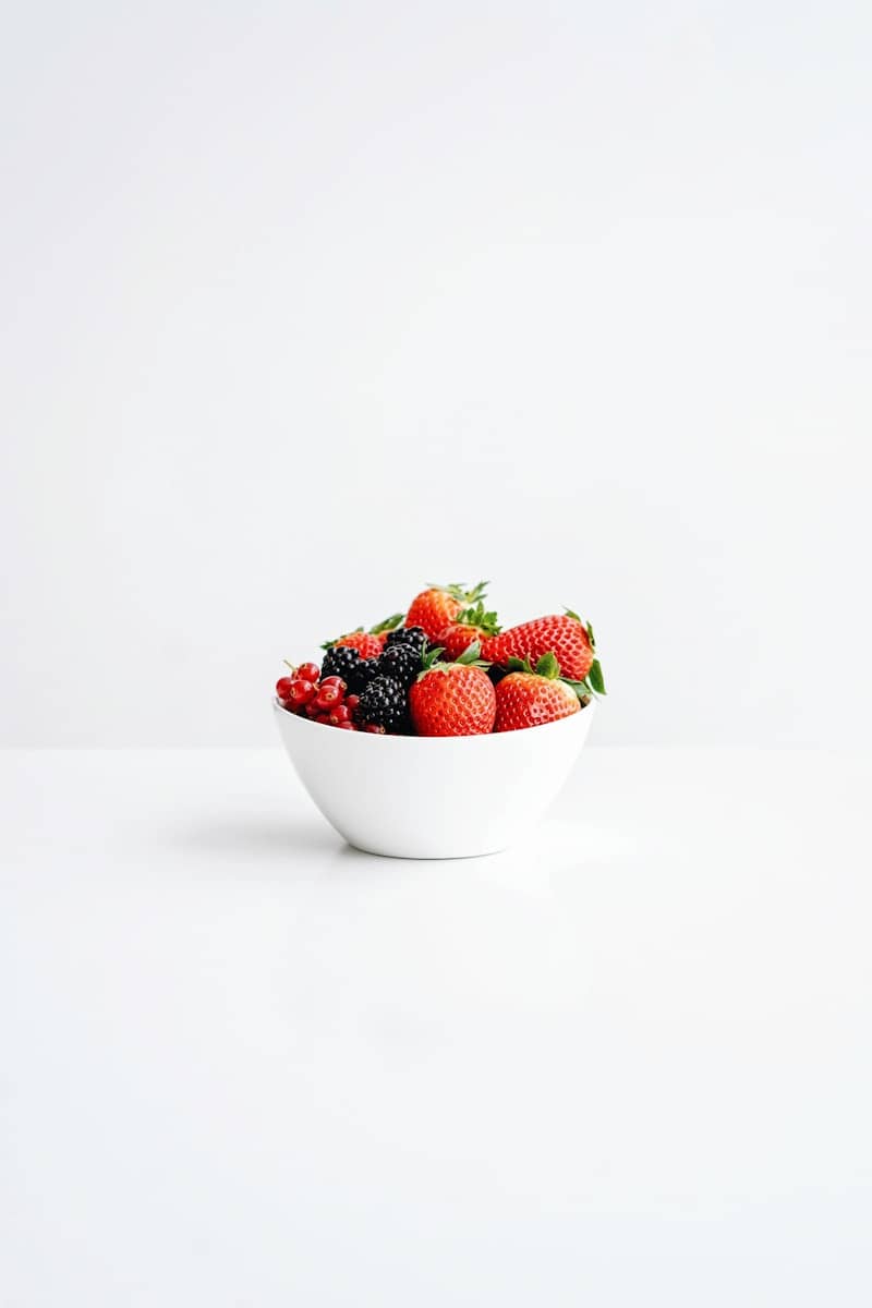 strawberries in white ceramic bowl