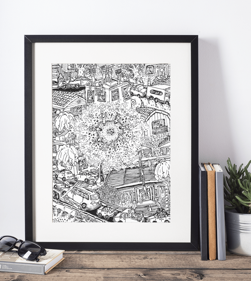 mockup-of-a-picture-frame-standing-on-a-wooden-table-and-against-a-white-wall