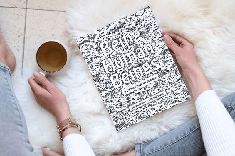 Landscape-softcover-book-8x10-in-the-hand-of-a-woman-holding-a-cup-of-tea_coloringbook_design_cover