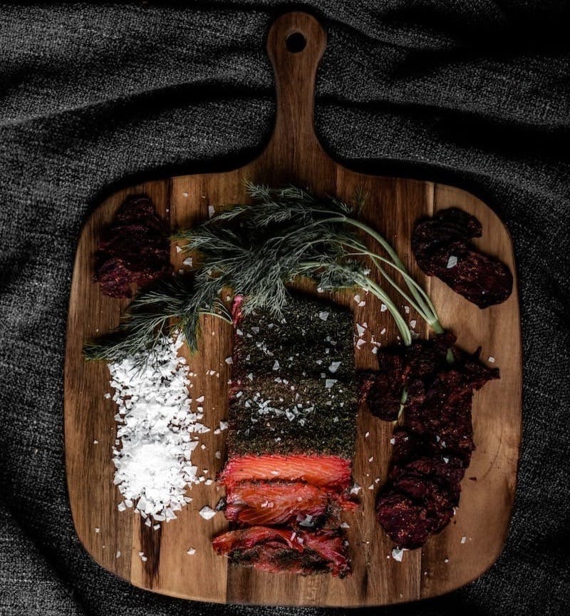 cooked food on brown wooden chopping board