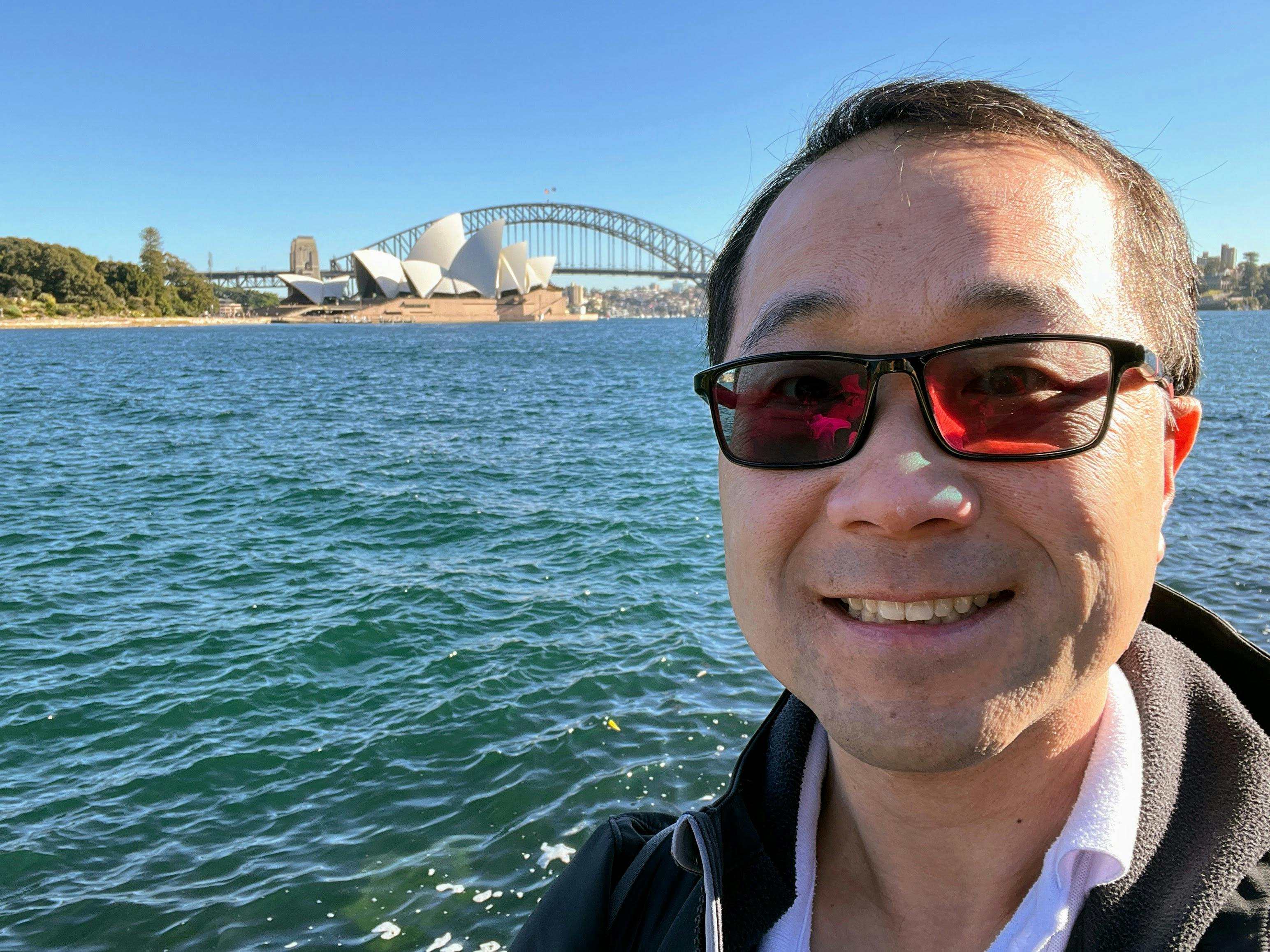 Jimmy Wong standing in front of Sydney Opera Housee