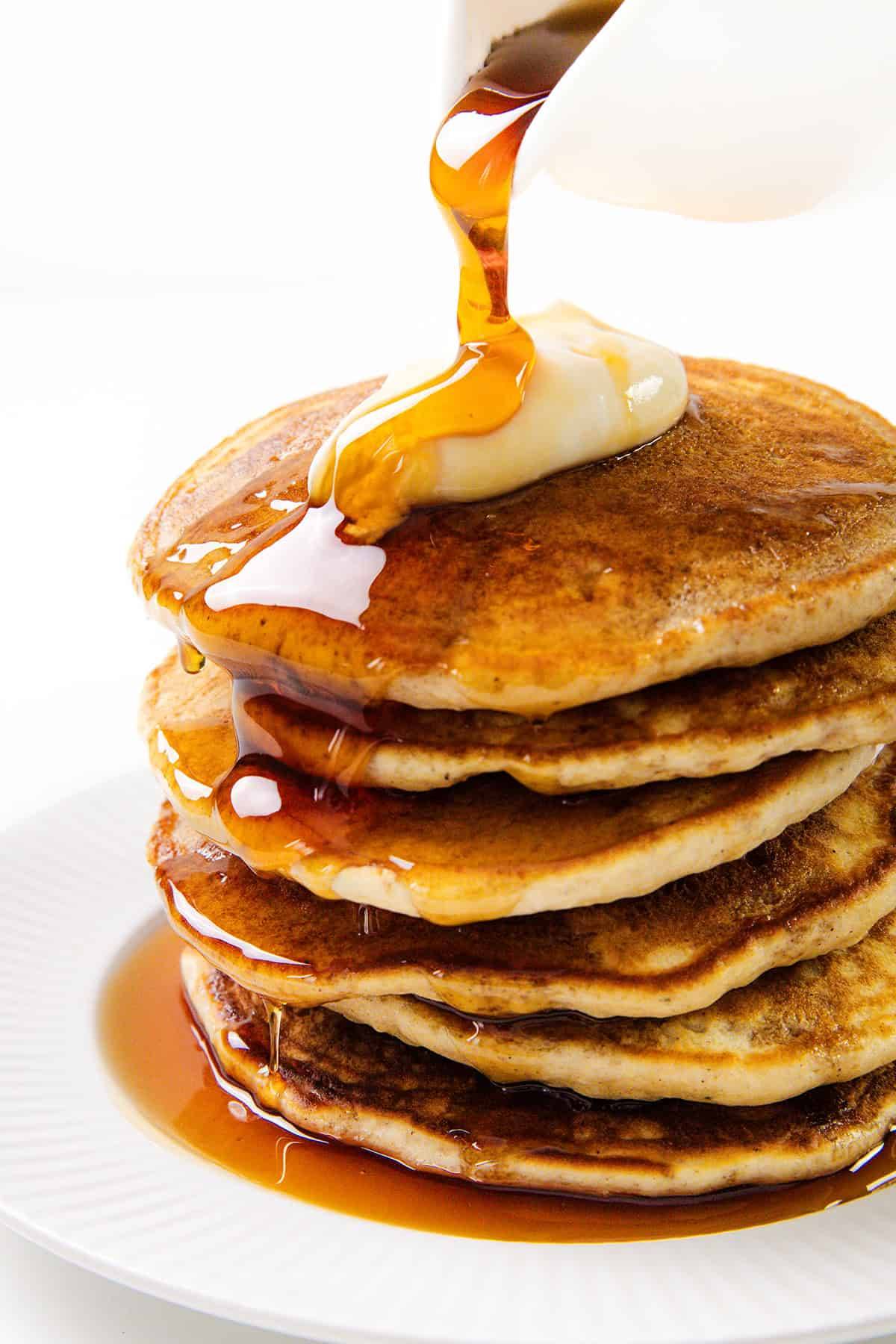 sour cream pancakes with melting butter and syrup
