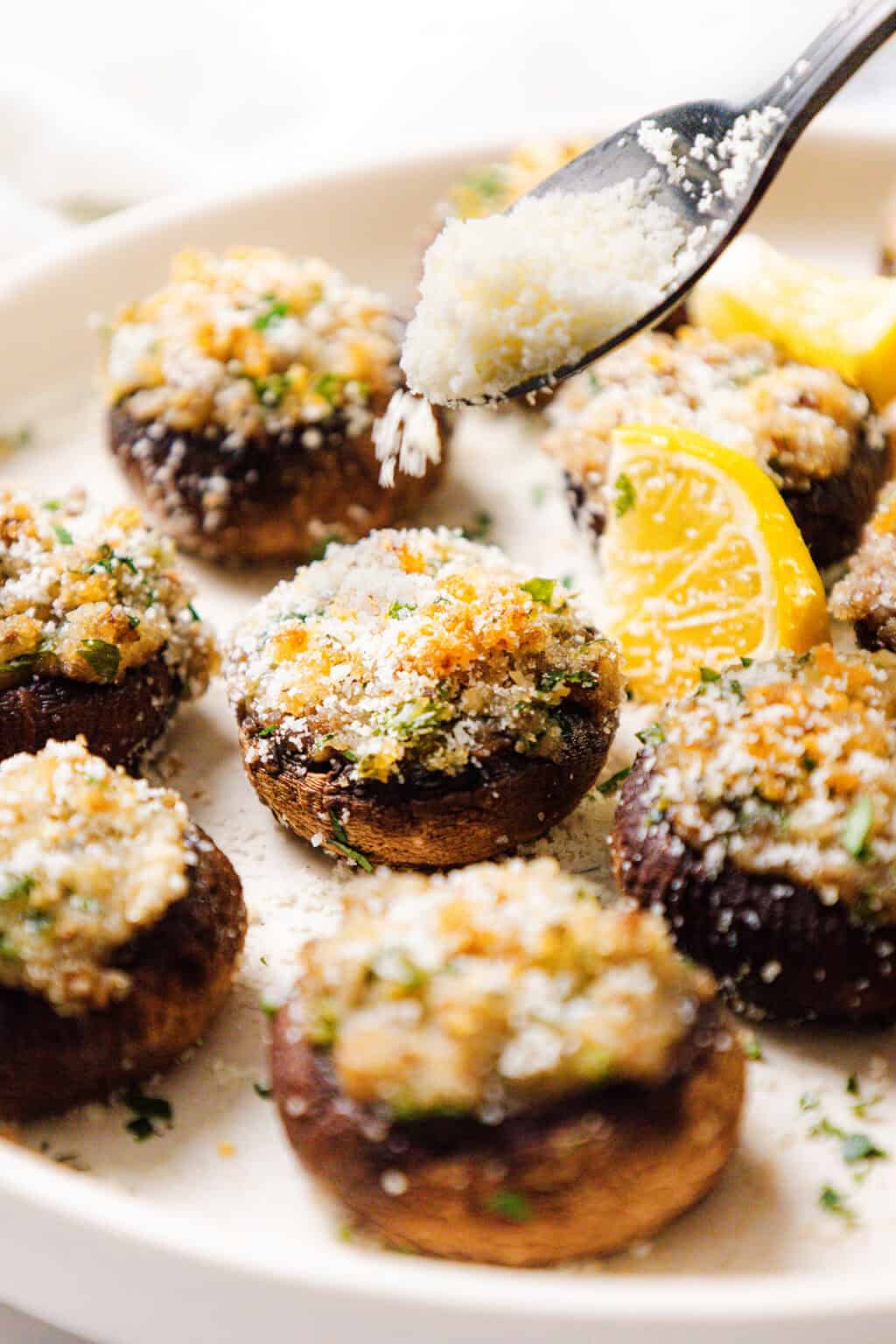 stuffed mushrooms garnished with cheese and lemon 