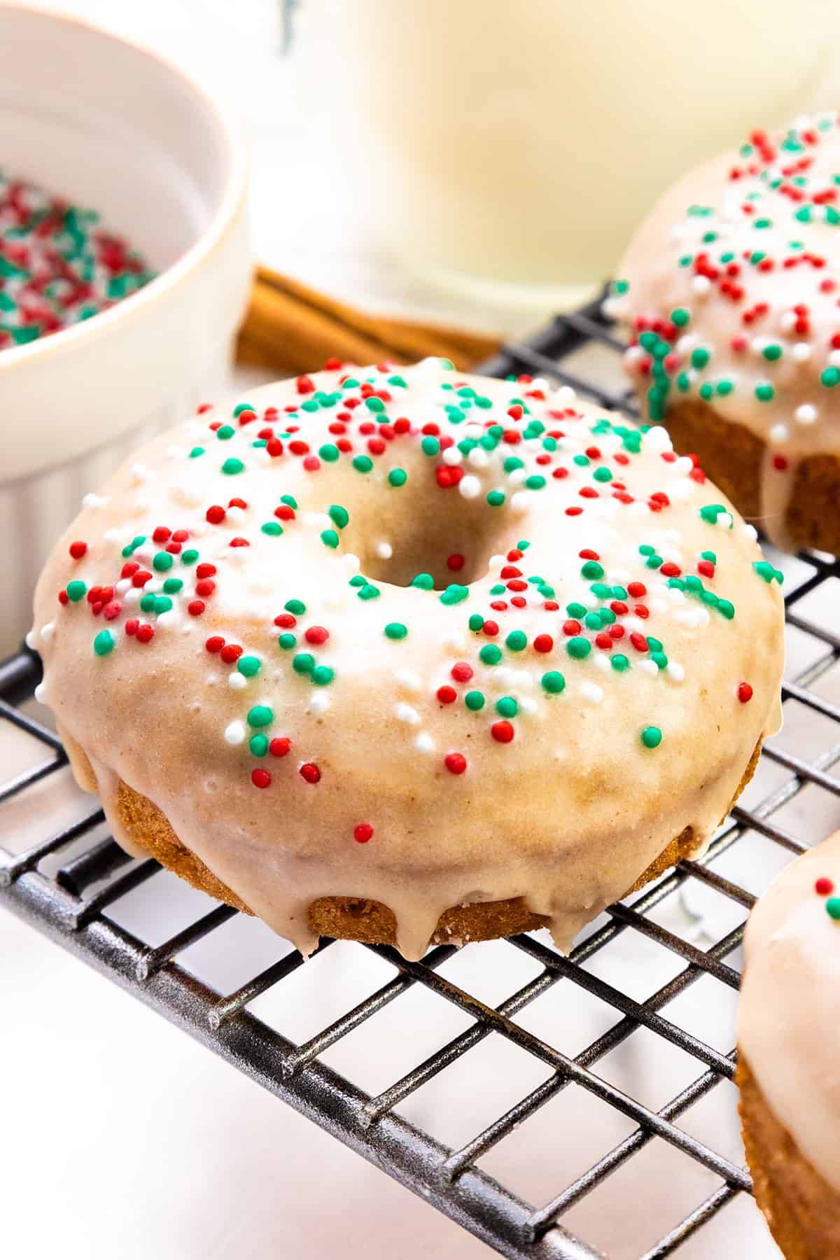 gingerbread christmas donut with icing and red and green sprinkles