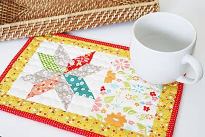 Midsummer Star Mug Rug by Sherri of A Quilting Life