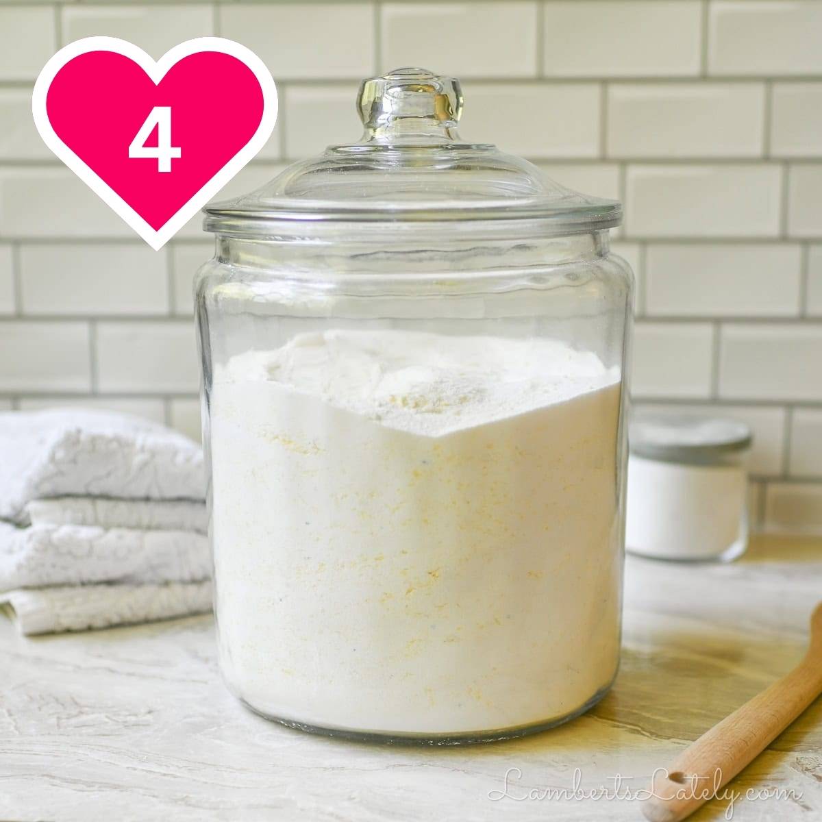 #4 - container of powder laundry detergent.