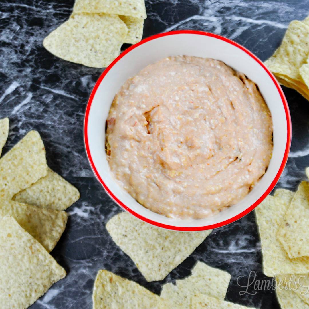 cream cheese and salsa dip in a bowl, surrounded by chips.