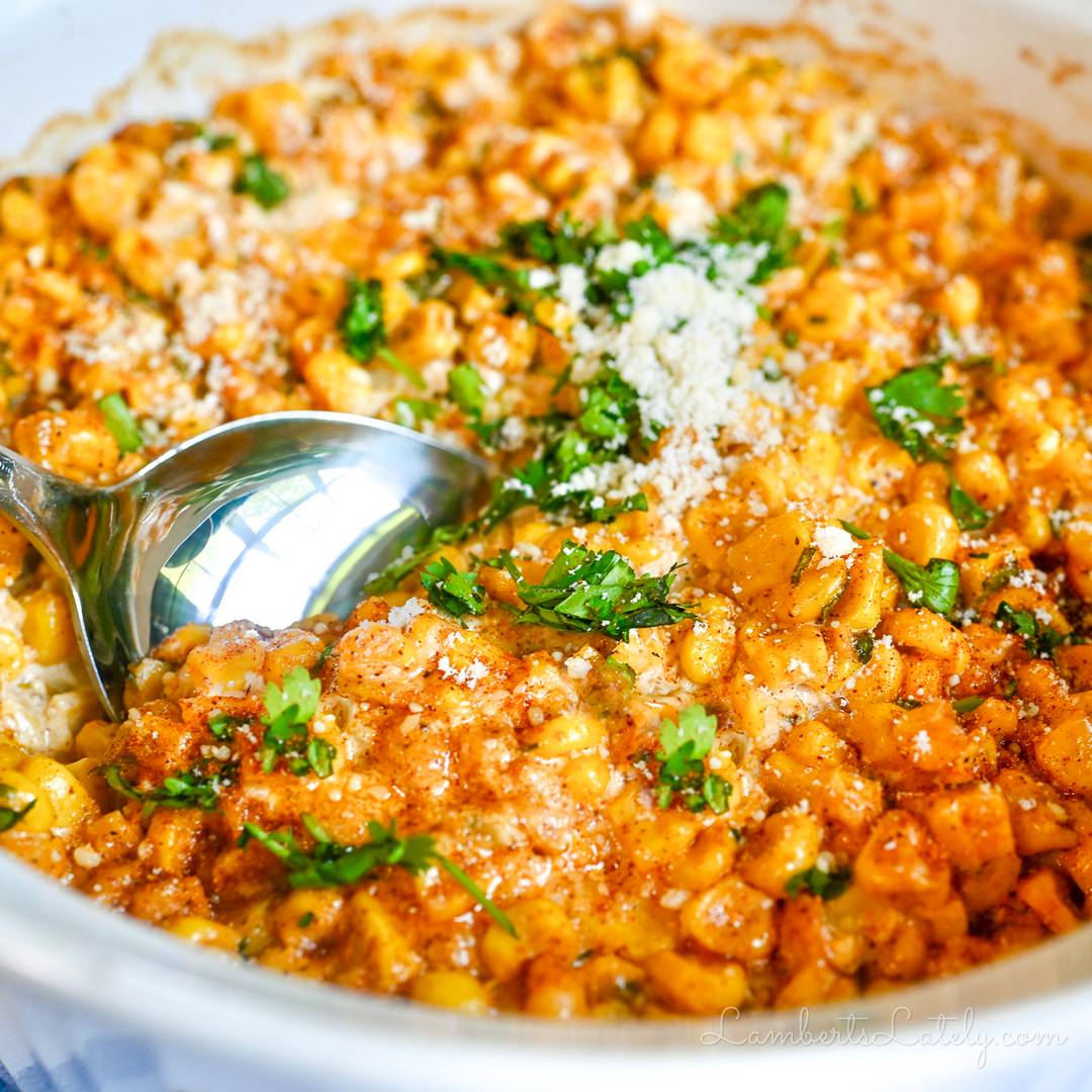 putting a spoon in mexican street corn casserole.