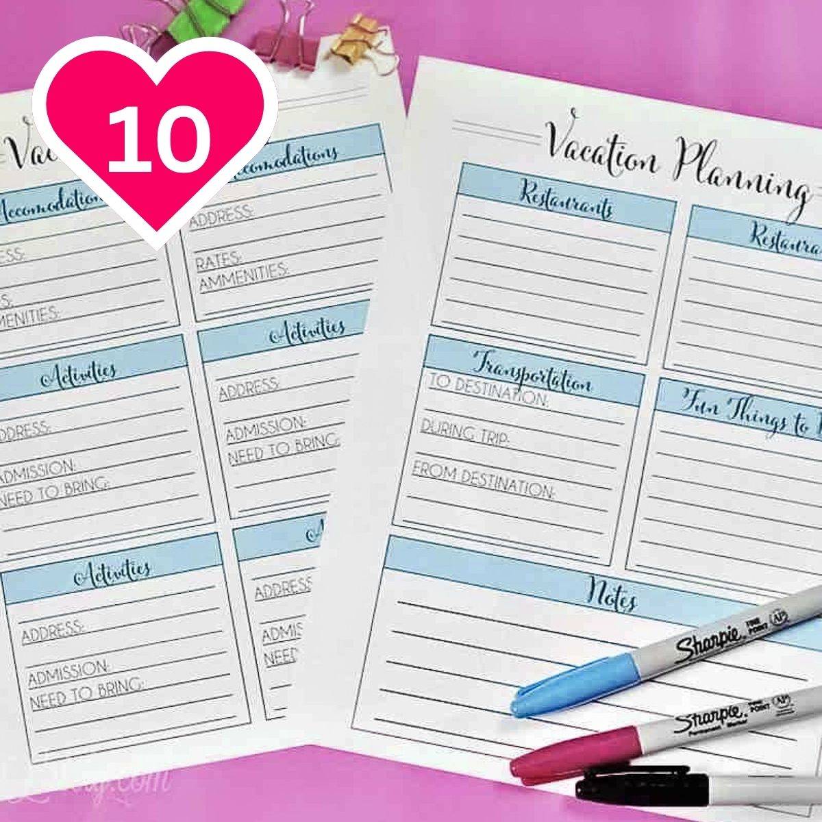 Two printed pages of a vacation planner template resting on a vibrant pink background. The page on the right is titled "Vacation Planning" and features sections for "Restaurants," "Transportation," "Fun Things to Do," and "Notes." Three Sharpie markers (b