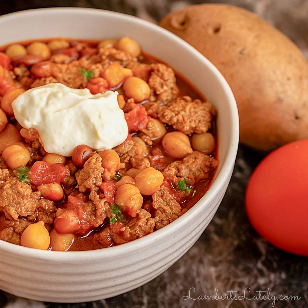 A hearty bowl of homemade chili topped with sour cream.