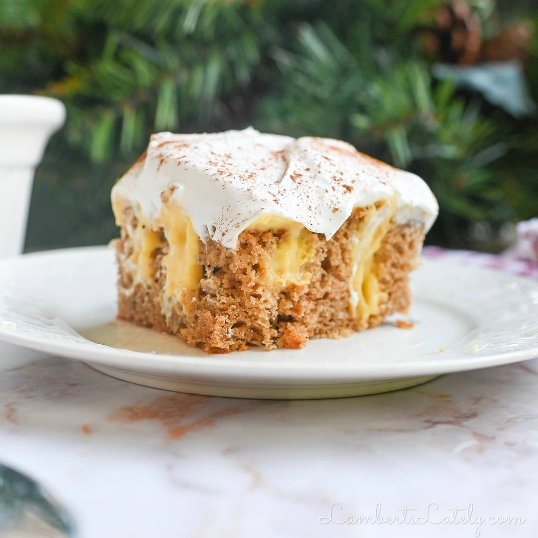 piece of eggnog poke cake on a plate.