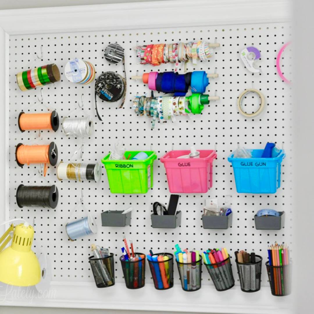 pegboard hanging in a craft room.