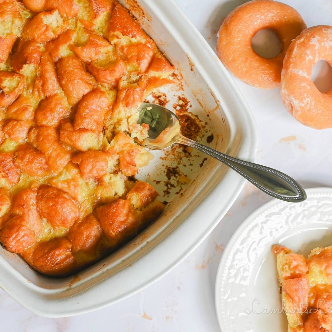 donut bread pudding in a casserole dish, next to donuts, a plate with a serving.