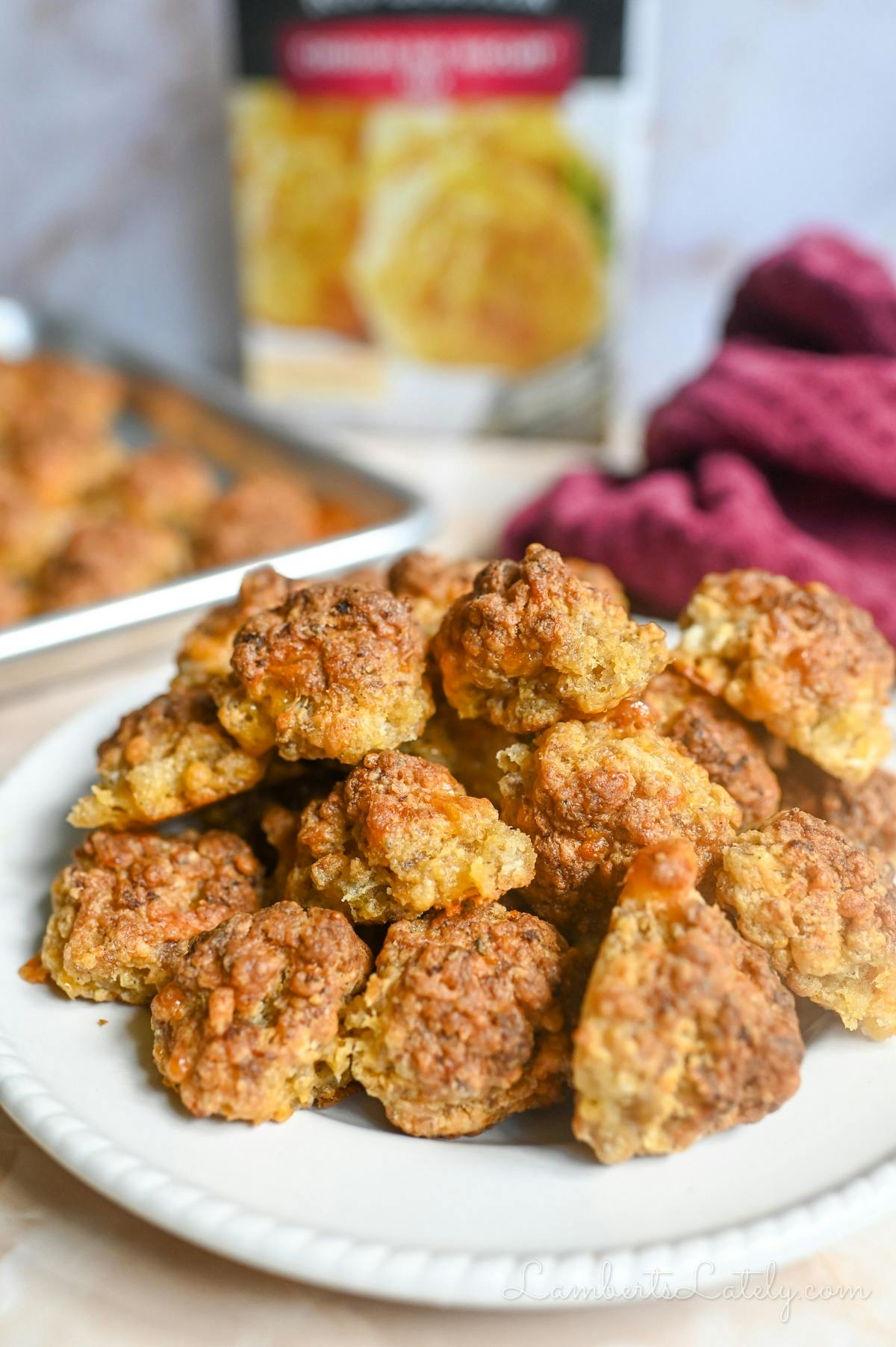 sausage balls stacked on a plate.