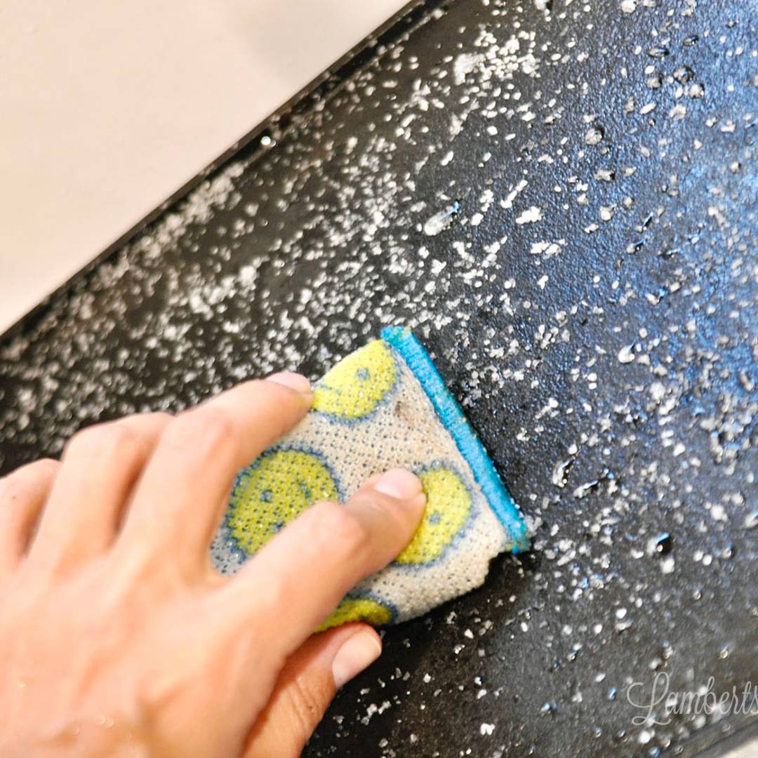 cleaning cast iron with a scrub pad and salt.