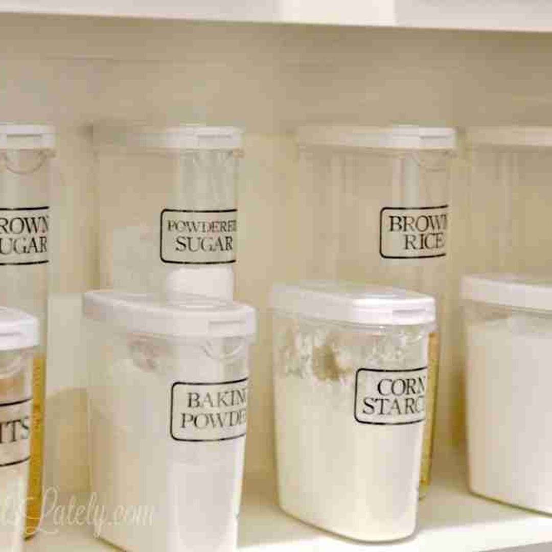 pantry containers labeled with clear tape.