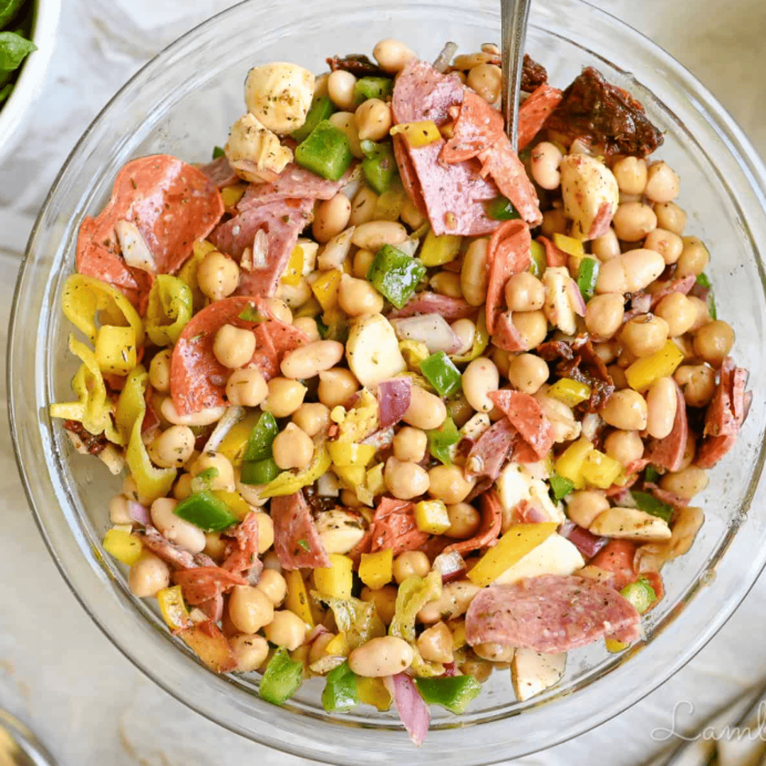 italian dense bean salad in a clear bowl.