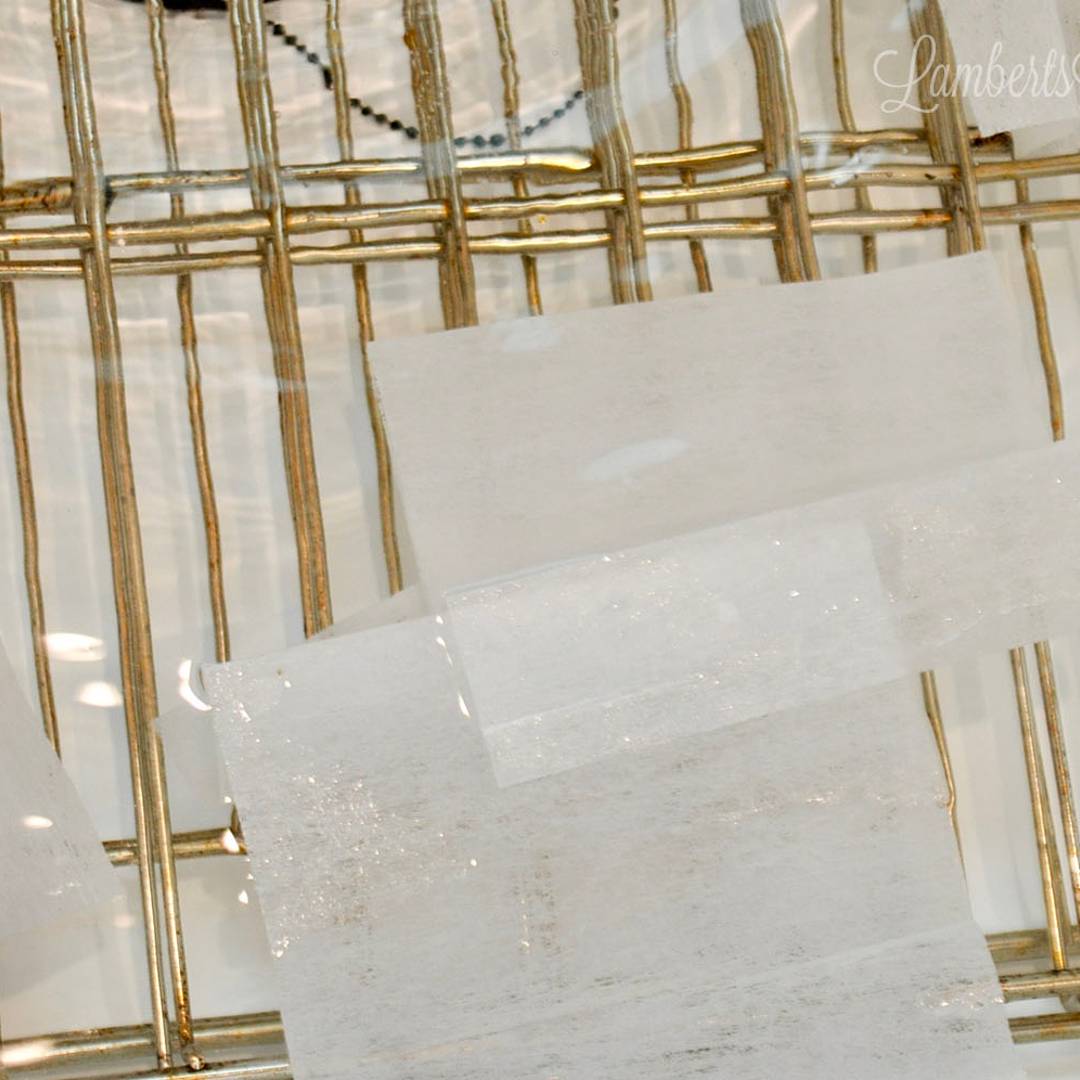oven racks in water, with dryer sheets.