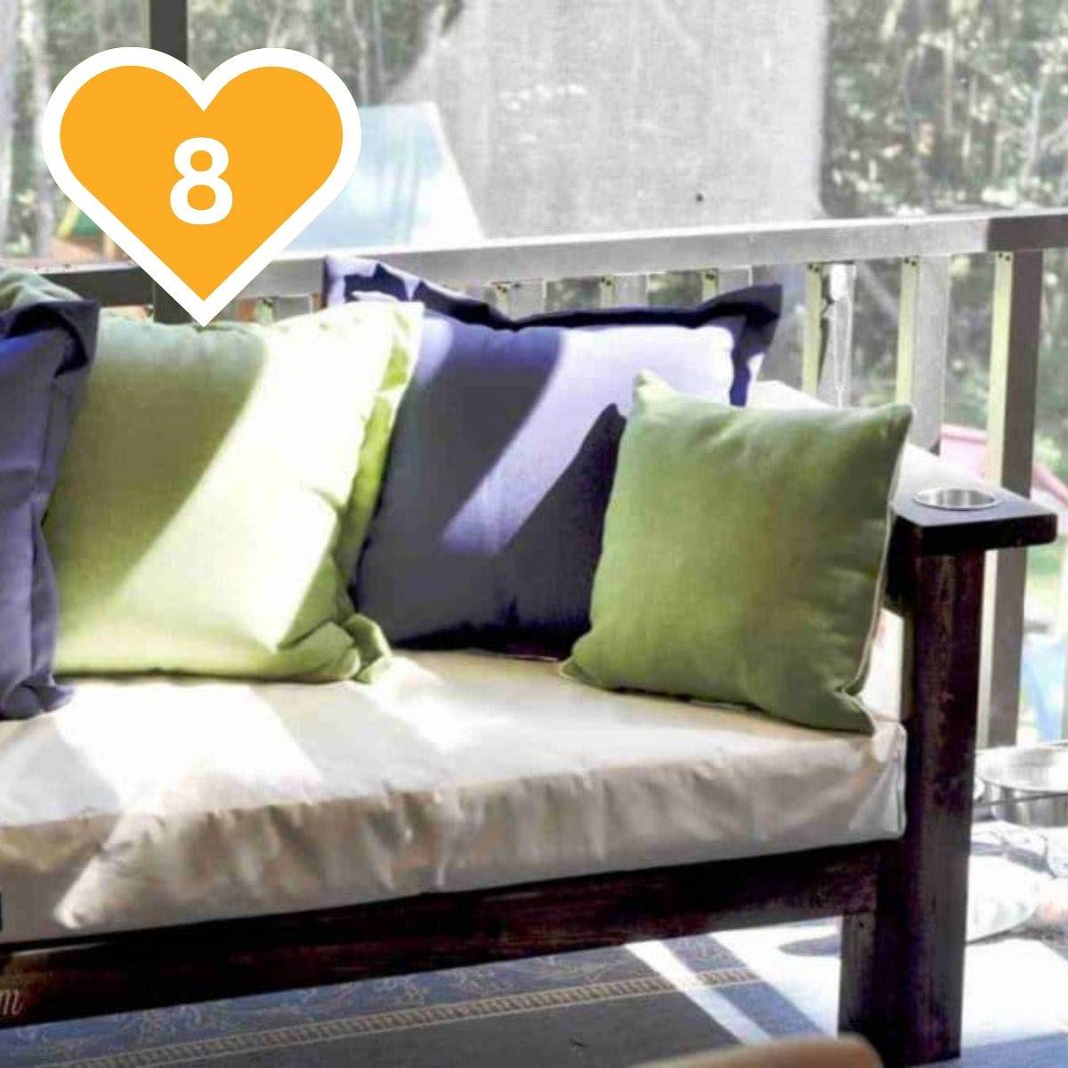 8 - Outdoor sectional with white cushion and colorful green and blue throw pillows.