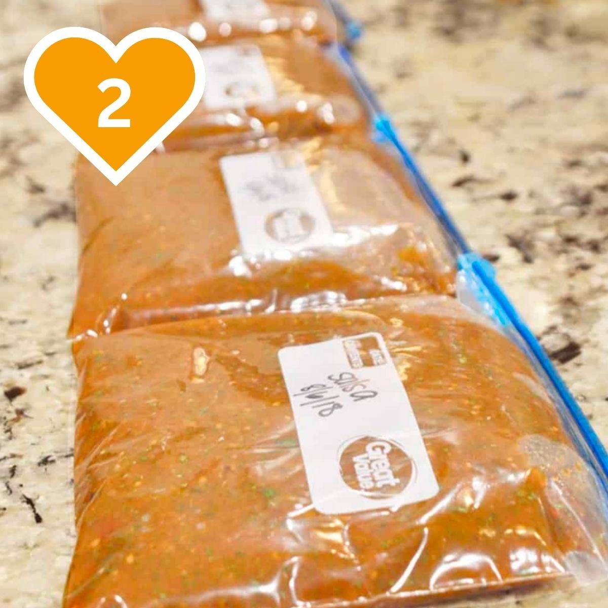 Homemade Mexican restaurant-style salsa stored in a sealed plastic freezer bag on a kitchen countertop.