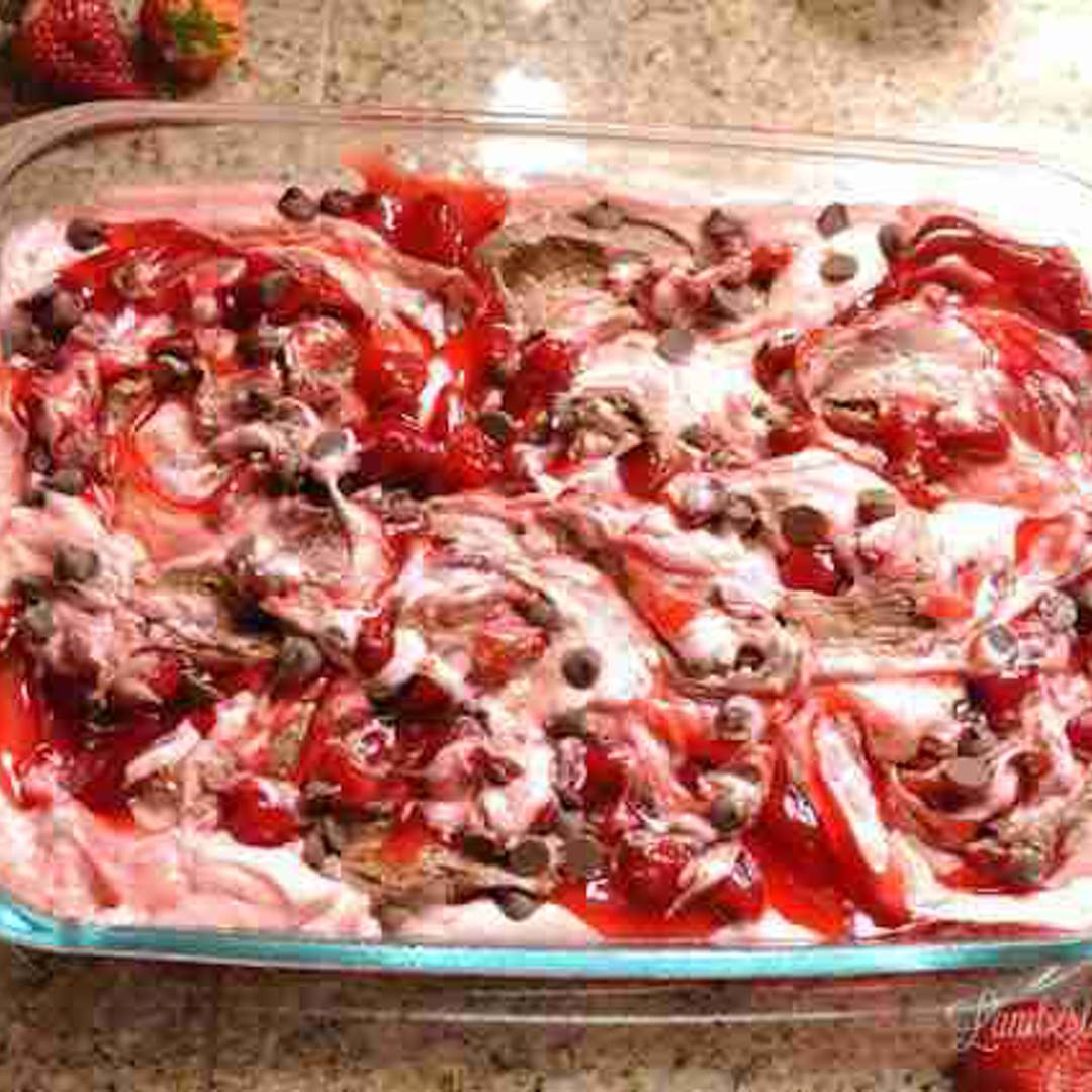 elements of chocolate strawberry cake swirled together in a baking dish.