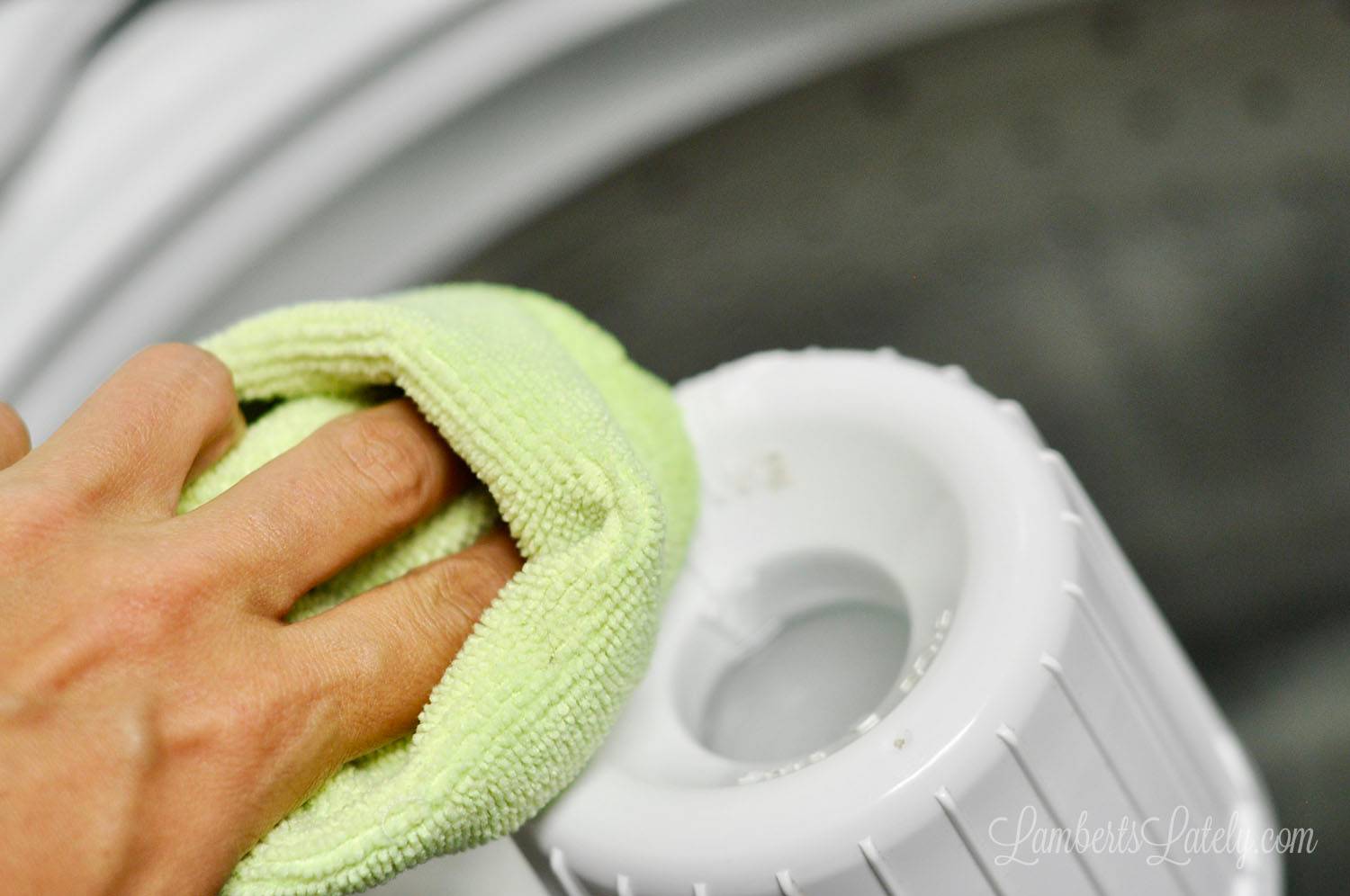 wiping the inside of a washing machine.