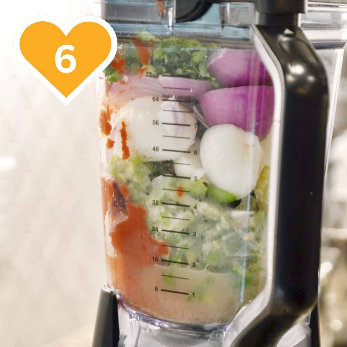 6 - Ingredients for salsa blended in a blender, including cilantro, onion, and tomatoes.