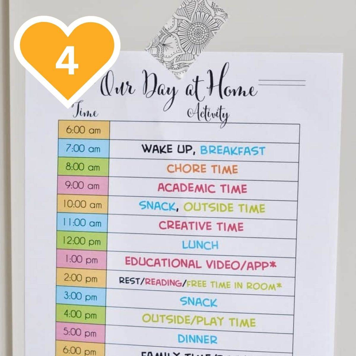 4 - Printable daily homeschool schedule displayed on a clipboard with colorful time blocks.