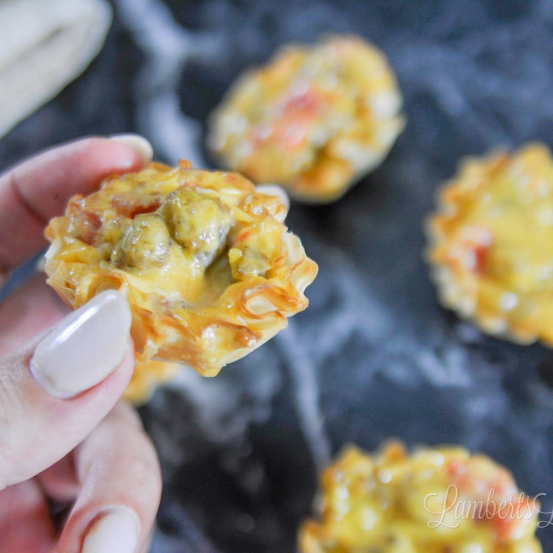 holding a cheesy rotel cup.