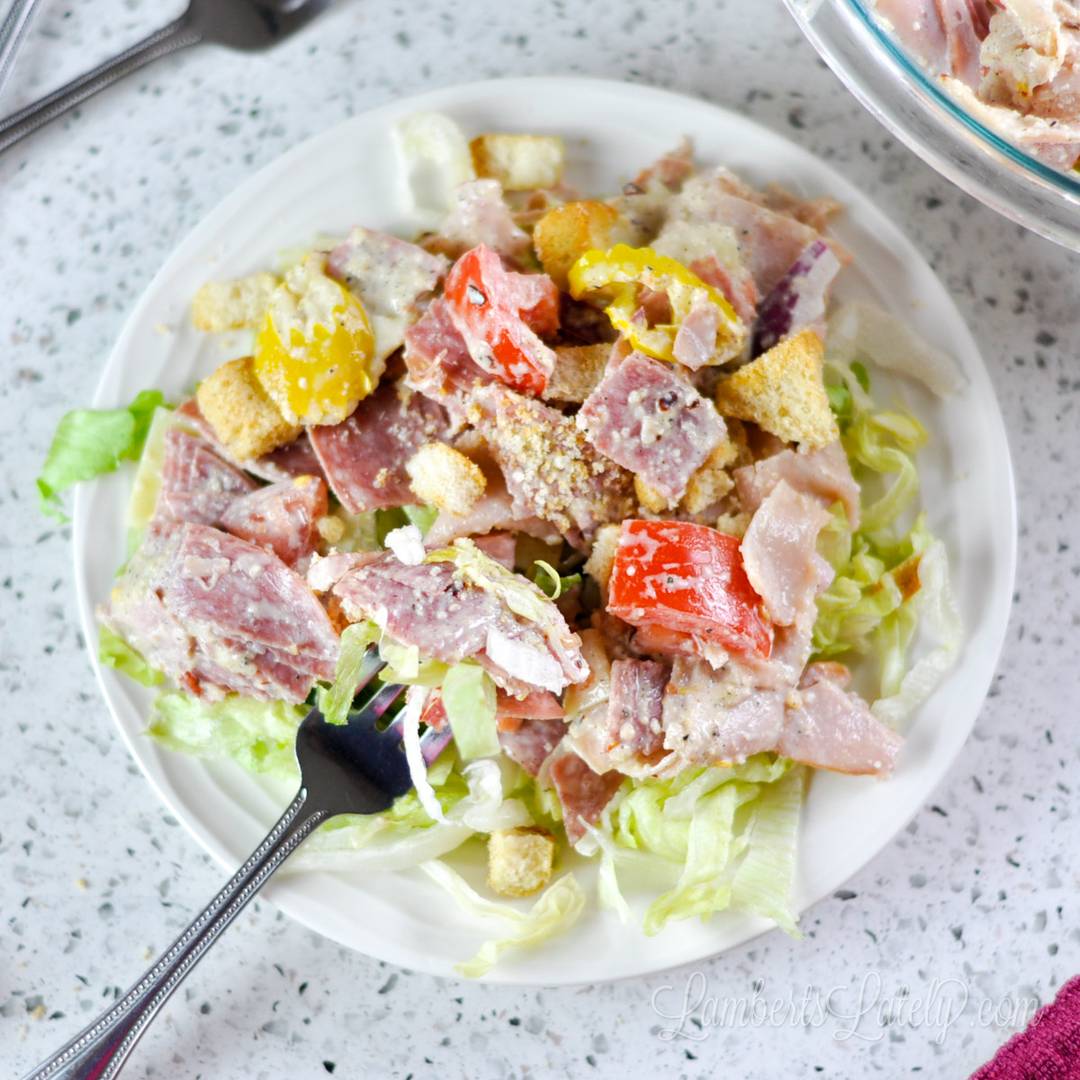 grinder salad on a plate with a fork.