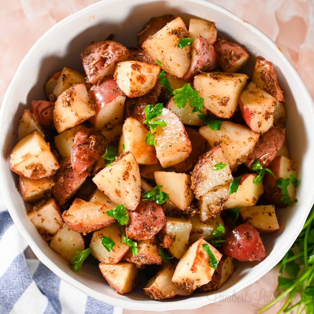 seasoned and cooked red potatoes in a bowl.