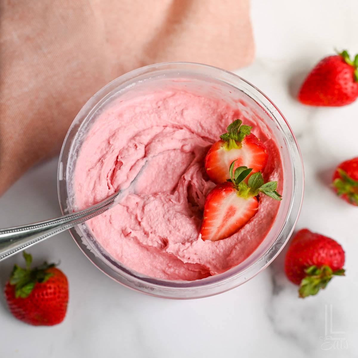 pint container of ninja creami strawberry ice cream.