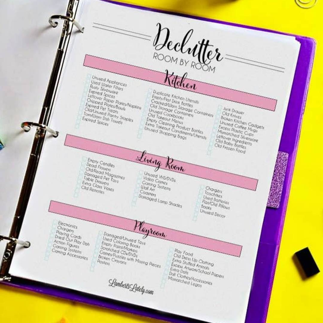 declutter room by room checklist in a notebook.