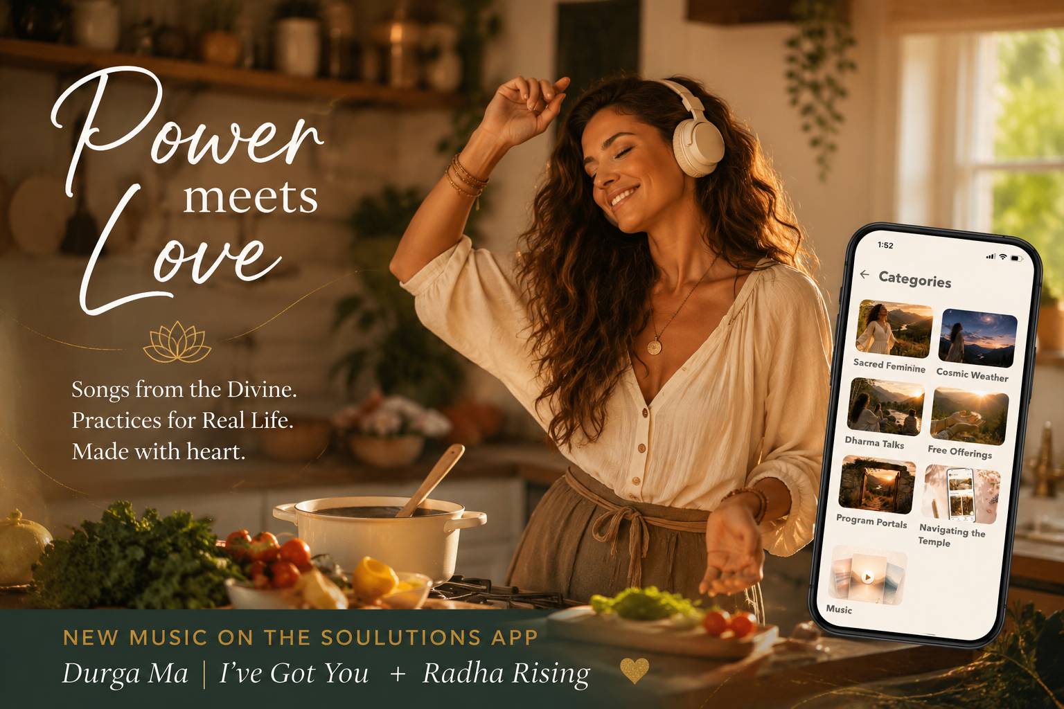 Woman wearing headphones dances while cooking in a sunlit kitchen beside a phone displaying the SOULutions app, celebrating new goddess kirtan music, Durga Ma | I’ve Got You and Radha Rising.