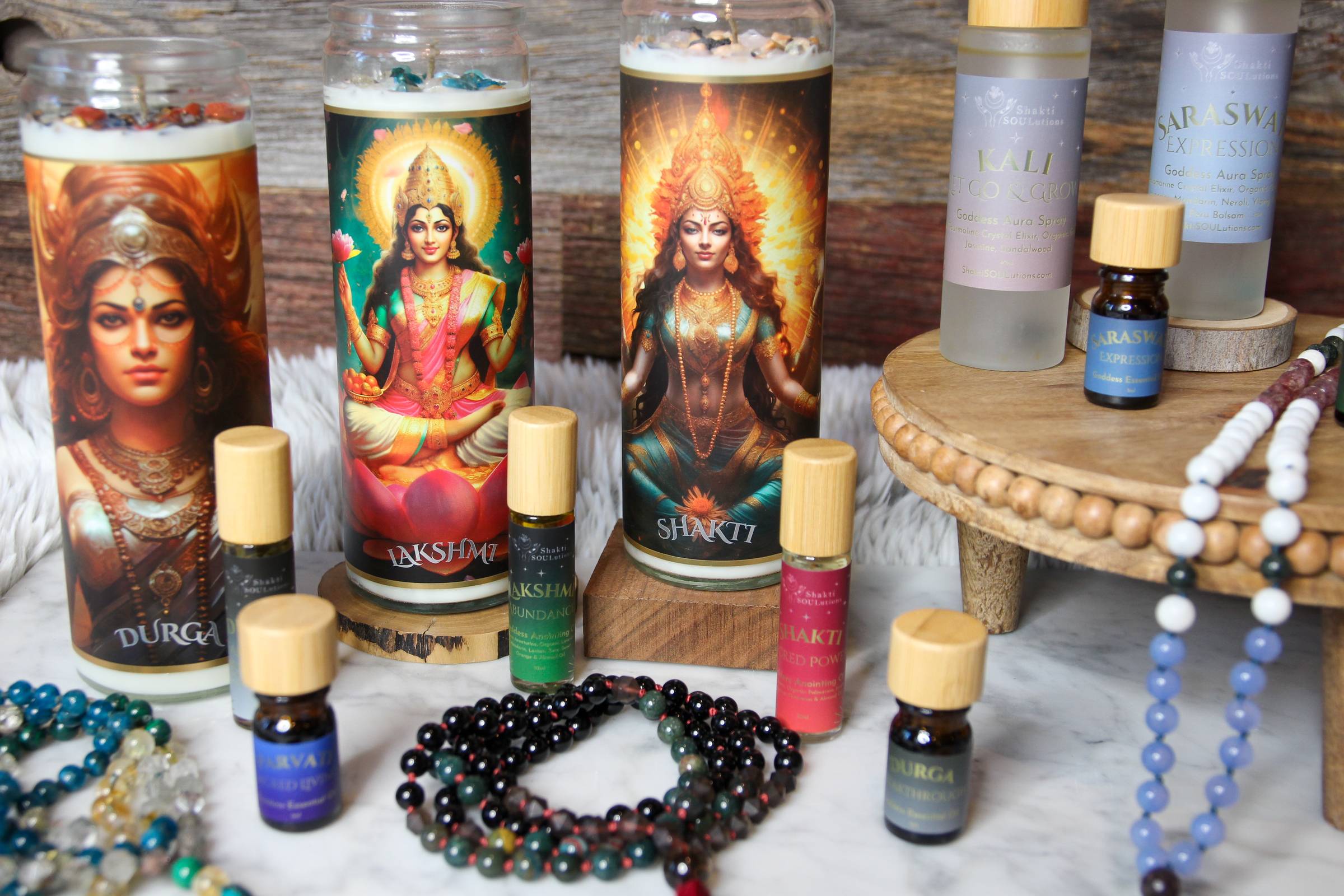 Shakti SOULutions crystal altar candles, organic essential oils, anointing oils and aura sprays arranged for clean living and sacred ritual.