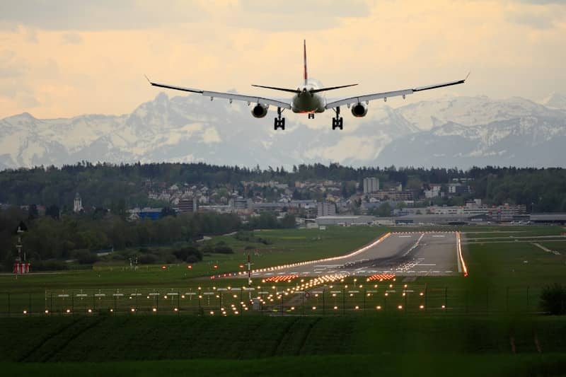 commercial airplane landing on runway