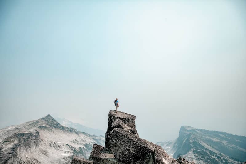 a person standing on top of a mountain